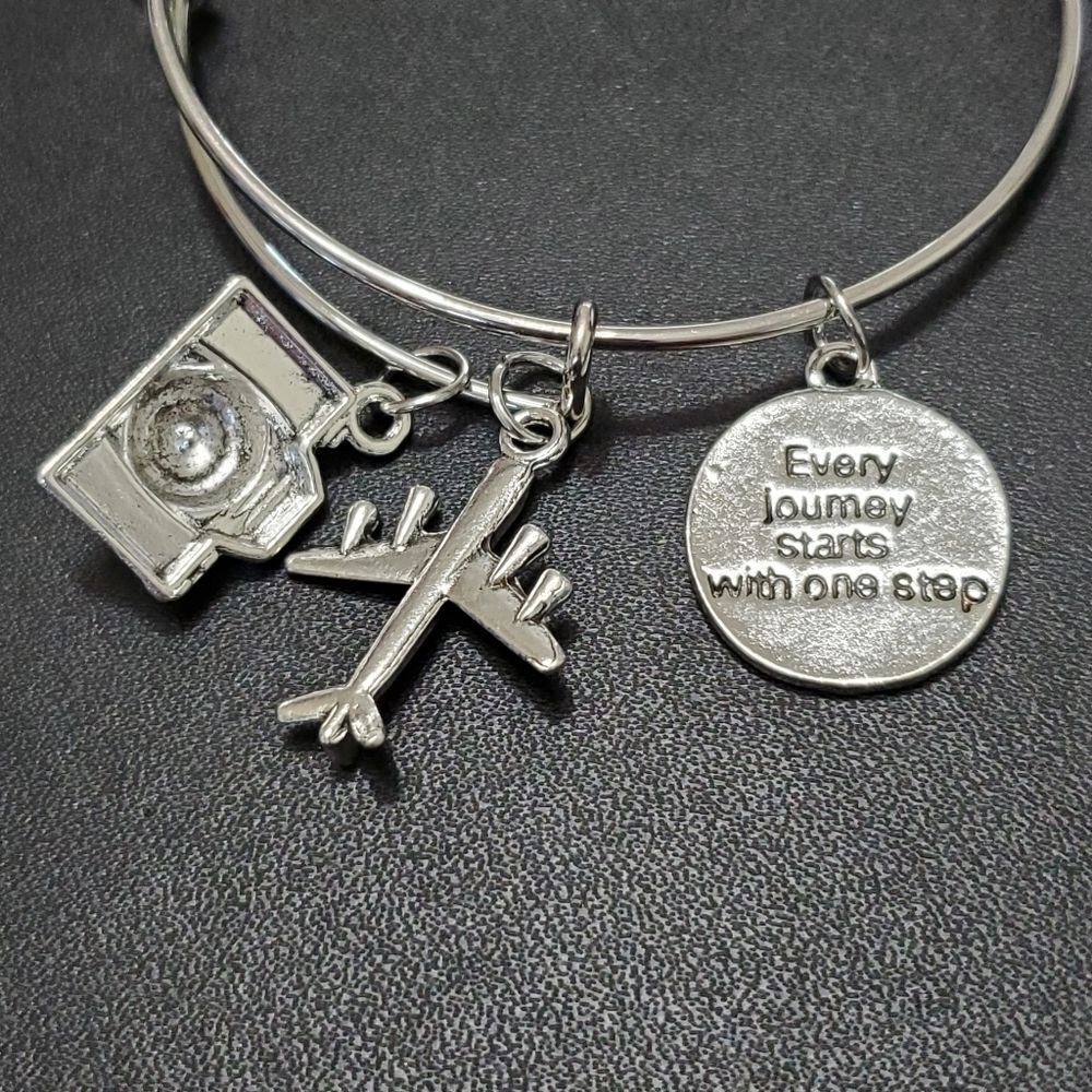Silver tone travel charms bangle bracelet 7.25"